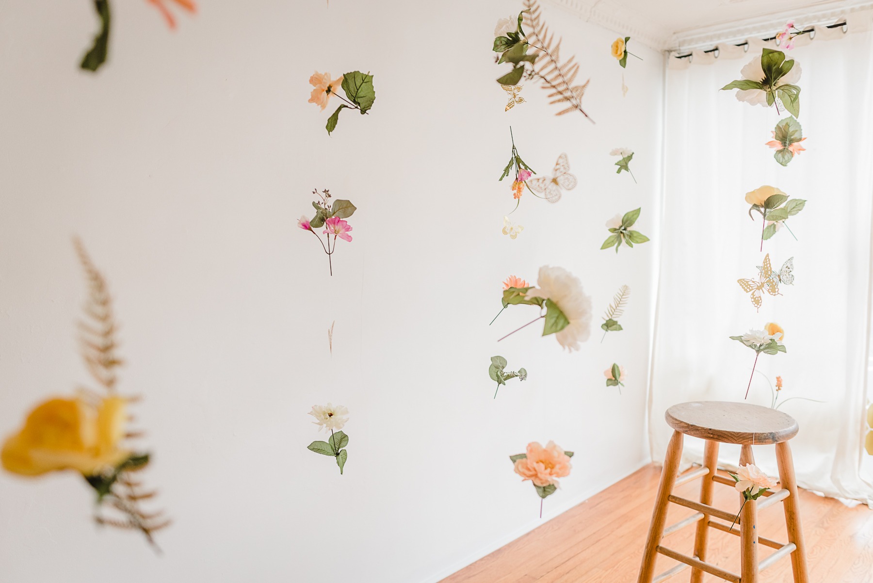 Studio Spring Mini Sessions near Charlotte, NC. A room of floating flowers and butterflies